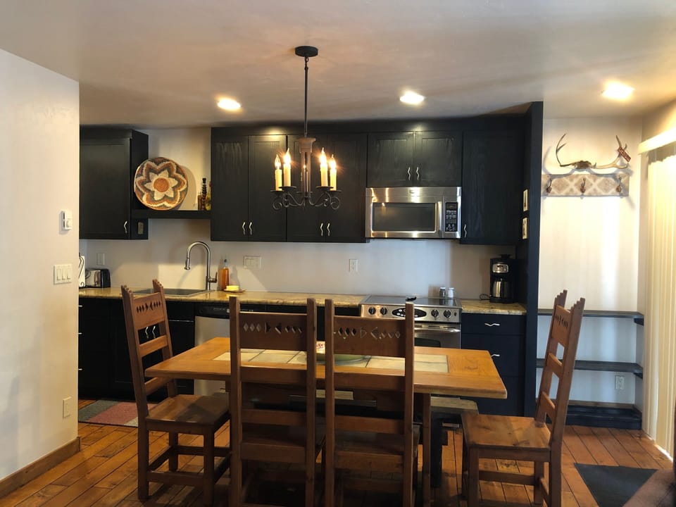 Dining Room/Kitchen Fully Stocked with Glassware, dishes, cookware, much more.
