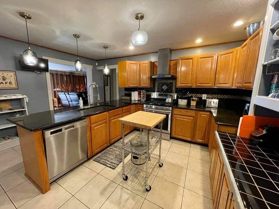 Kitchen with stainless stain appliances and gas range