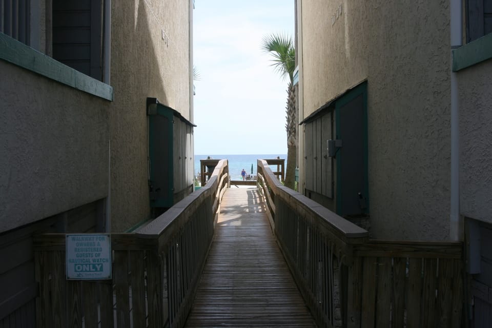 Beachfront Boardwalk directly to beach. Nautical Watch B building on right