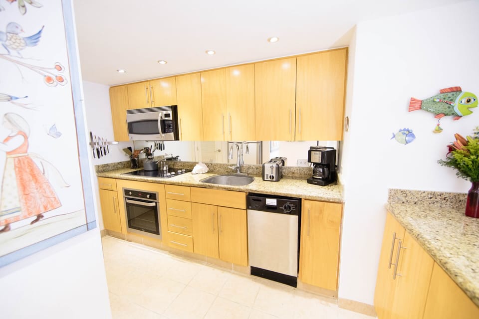 Tasteful, fully equipped modern kitchen.