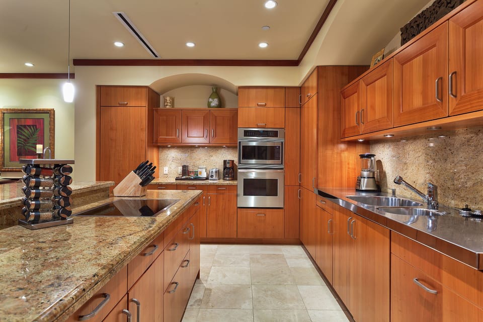 Gourmet kitchen with two Sub Zero refrigerators and fully stocked with utensils.