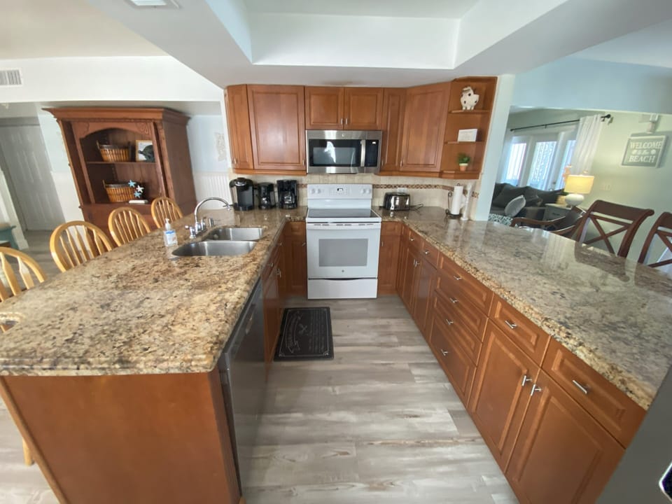 Stove, refrigerator, dishwasher and microwave.