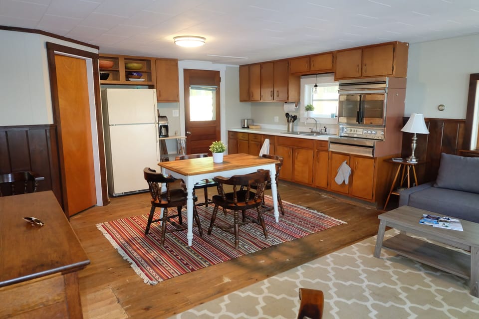Kitchen with dining table - door to full bath on left.