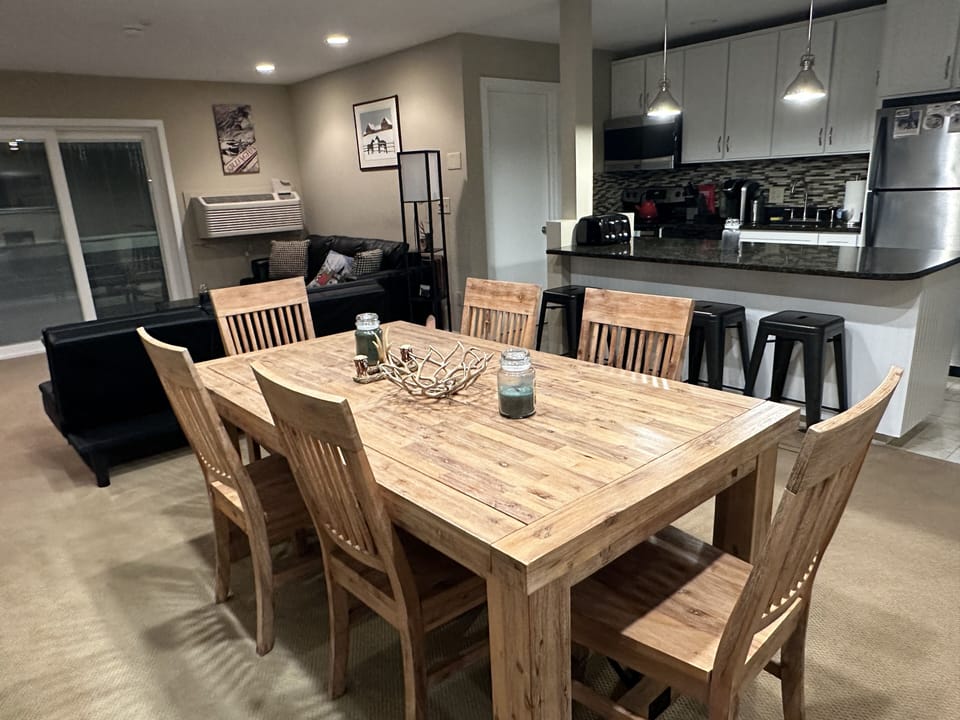 Dining room table and kitchen.  Balsam and Cedar candles for that Vermont vibe.