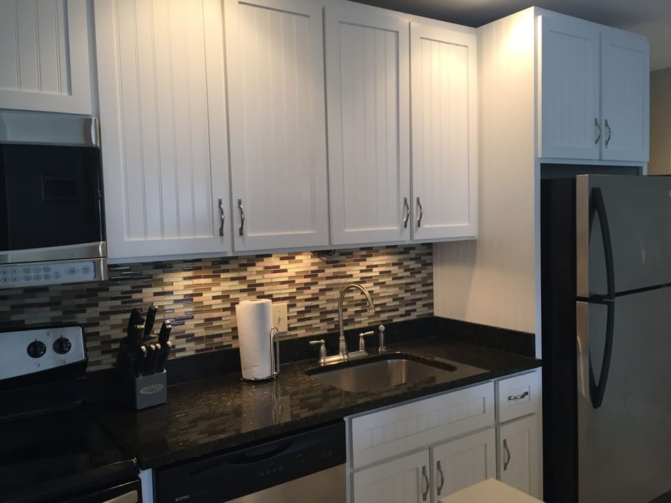 New Cabinets, Tile, Backsplash. Very chic kitchen with stainless appliances. 