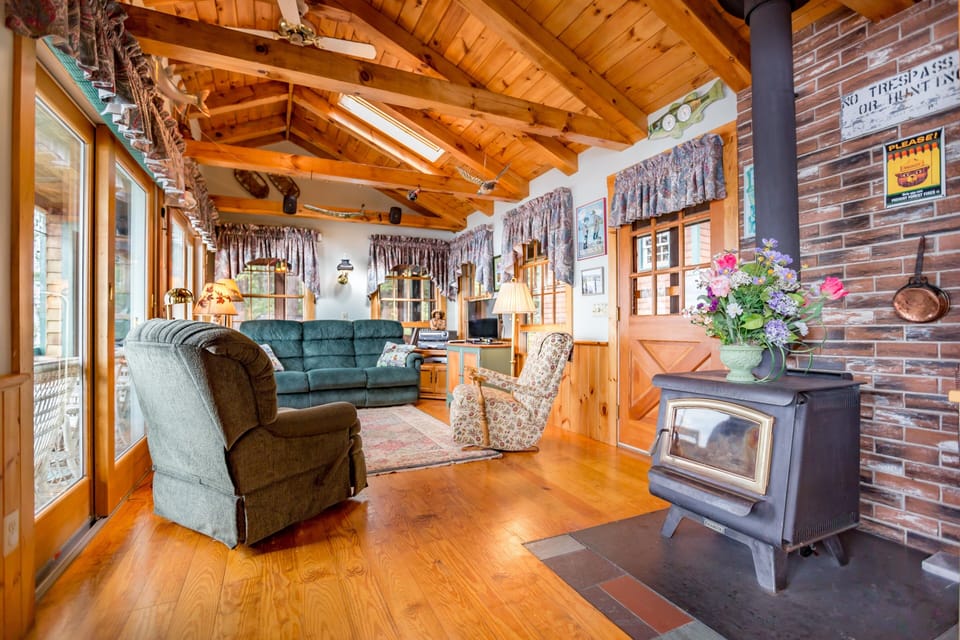 Looking From Kitchen To Family Room, Glass Door Wood Stove For Cool Evenings