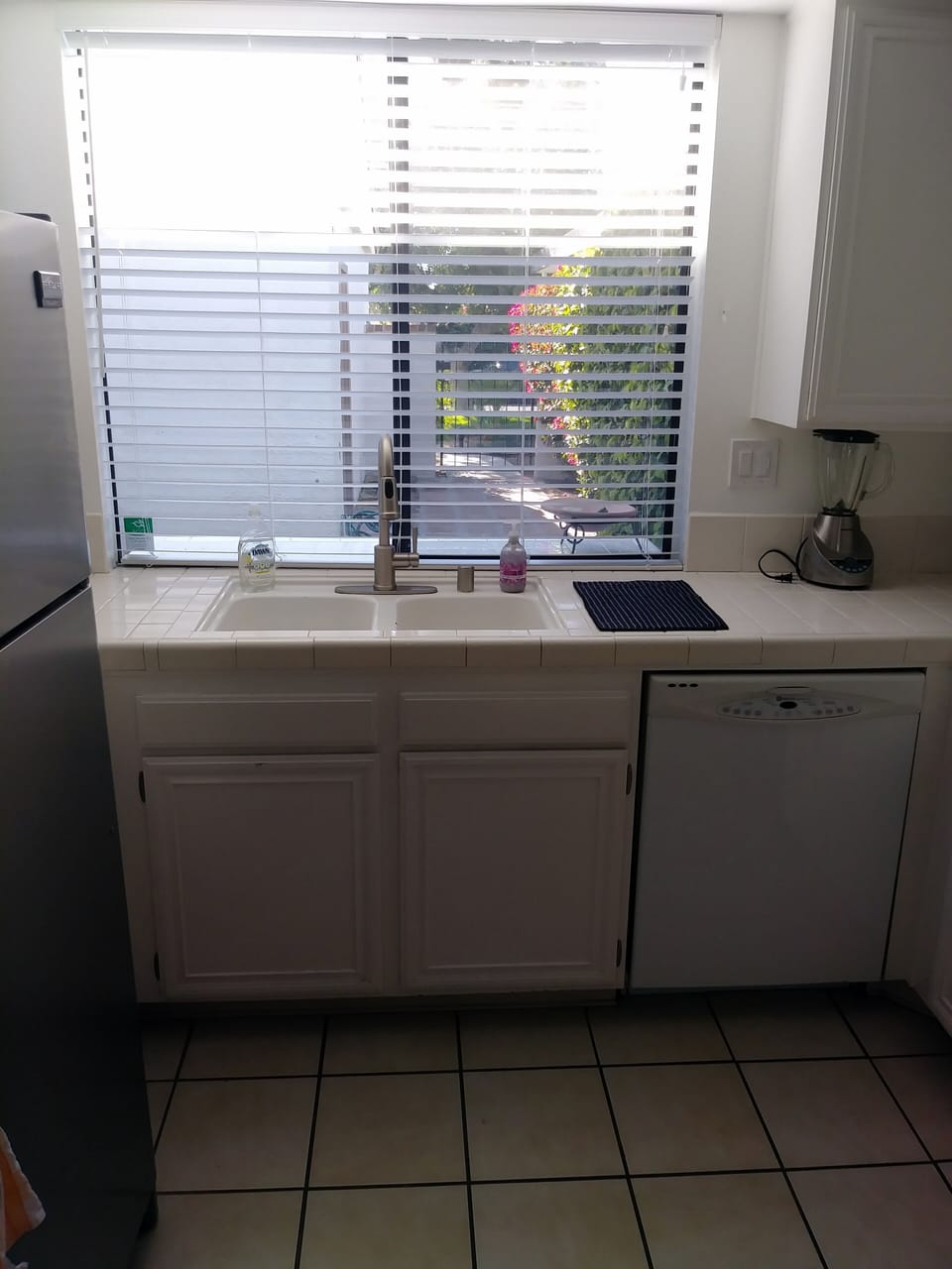 Kitchen window facing out into front courtyard.