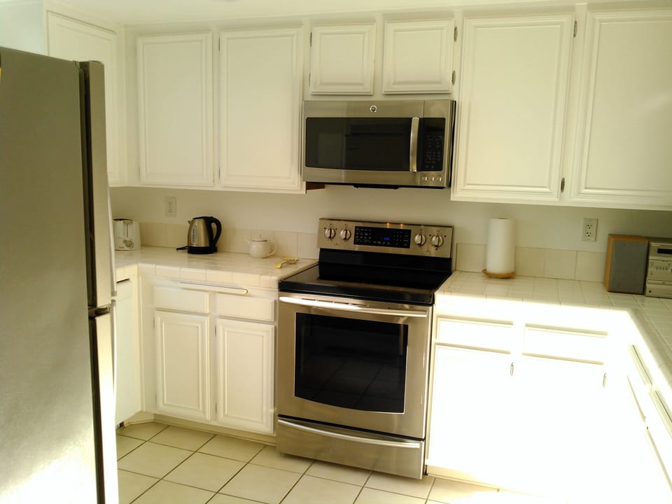 Kitchen has all major appliances + small basics (toaster, coffee maker, etc).