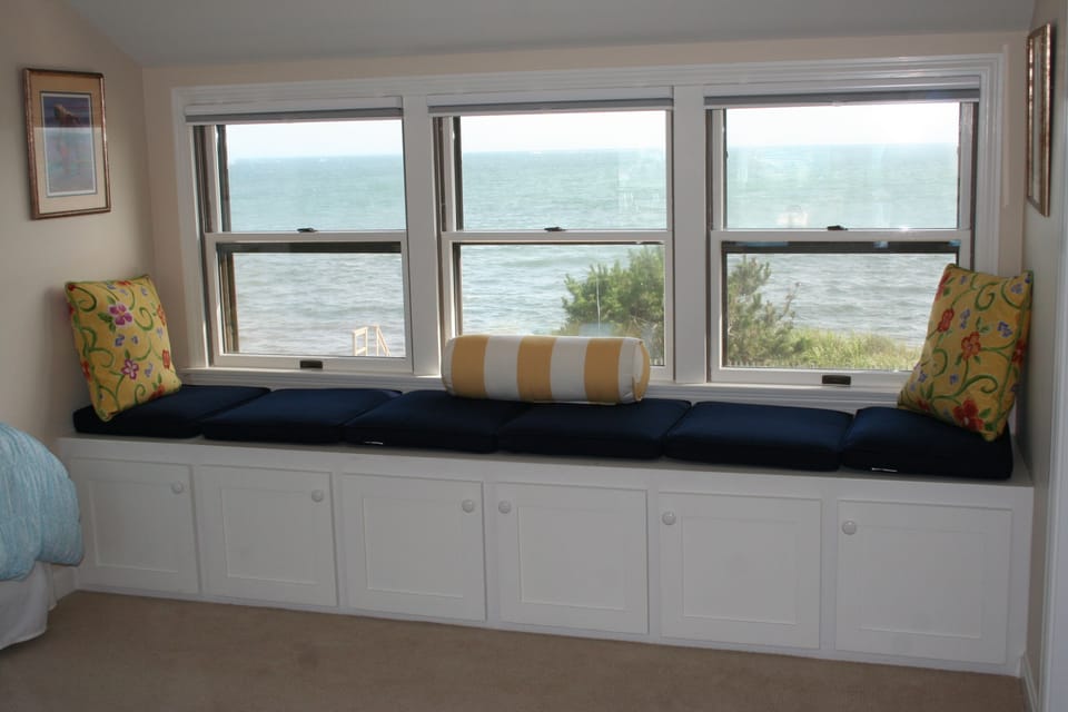 Enjoy watching sailboats on the horizon from this twin bedroom window seat!