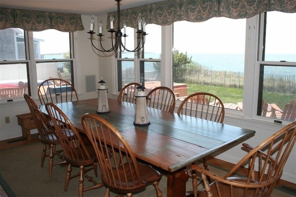 Dining Room with large one-of-a-kind  table made from barn staircase! Seats 8-12