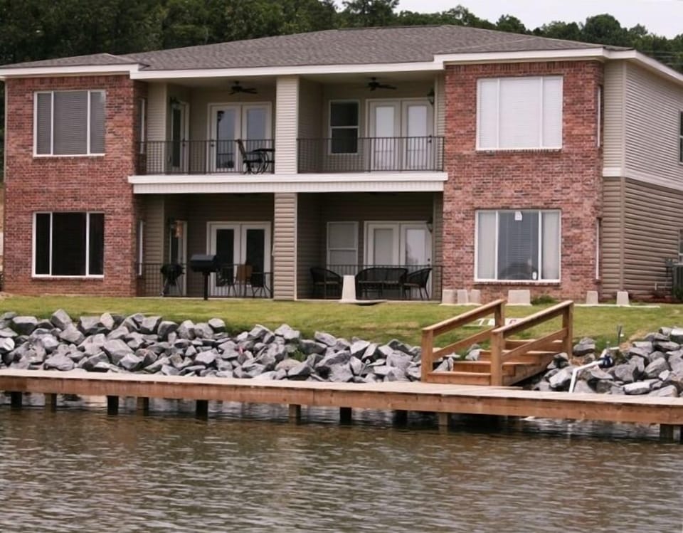 Back Patio to Lake-Lower Left Unit, boardwalk to fish, swim & benches to sit on.