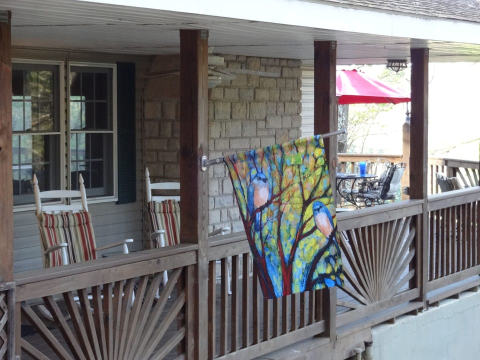 sit and rock on the covered deck or eat at 1 of 2 tables on the open deck