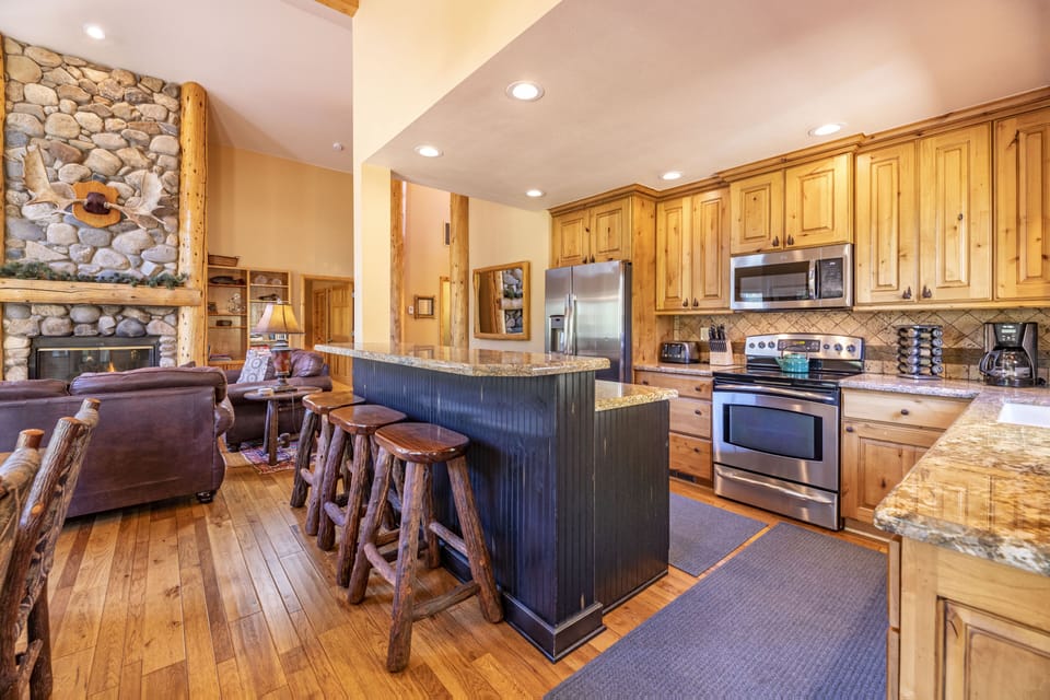 Gourmet kitchen--stainless steel appliances, granite counters, & alder cabinets.