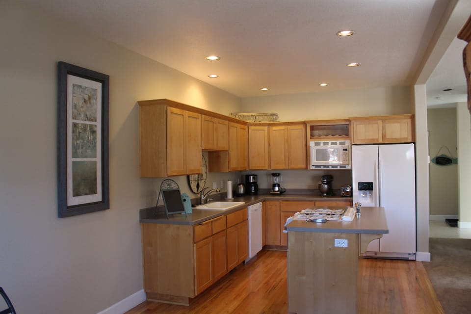 Fully stocked kitchen.
Bar stools at kitchen counter that seats 2 not shown