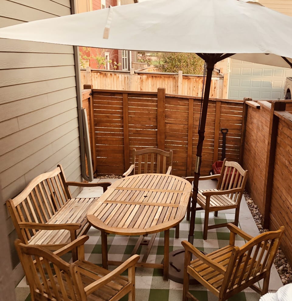 Relax in the teak chairs and enjoy some grilling time out on the porch!