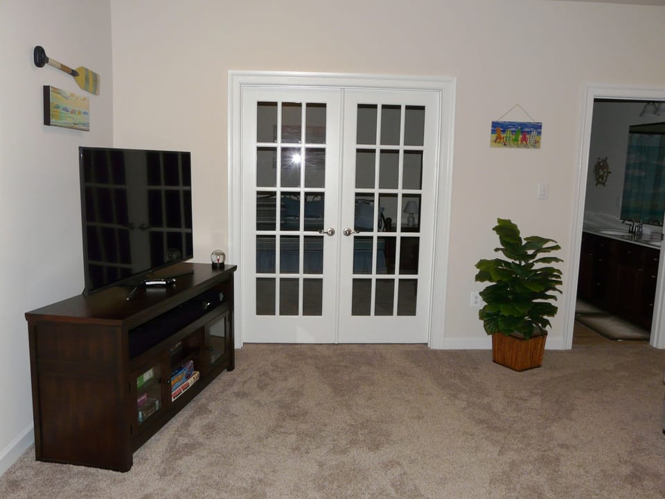 Doors to 5th Bedroom/Den with curtains inside for privacy.