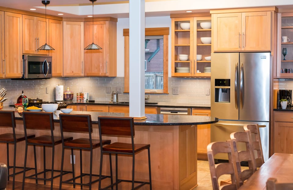 Modern kitchen is equipped with high-quality appliances, cutlery and silverware.