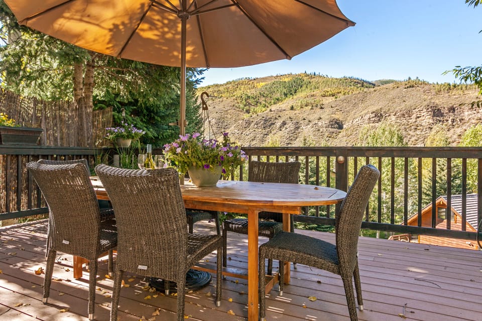 Huge wrap around deck with Dining Area, Hot Tub and BBQ Center