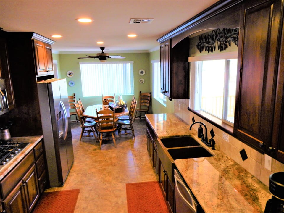 Upstairs kitchen and dining table for 8.
