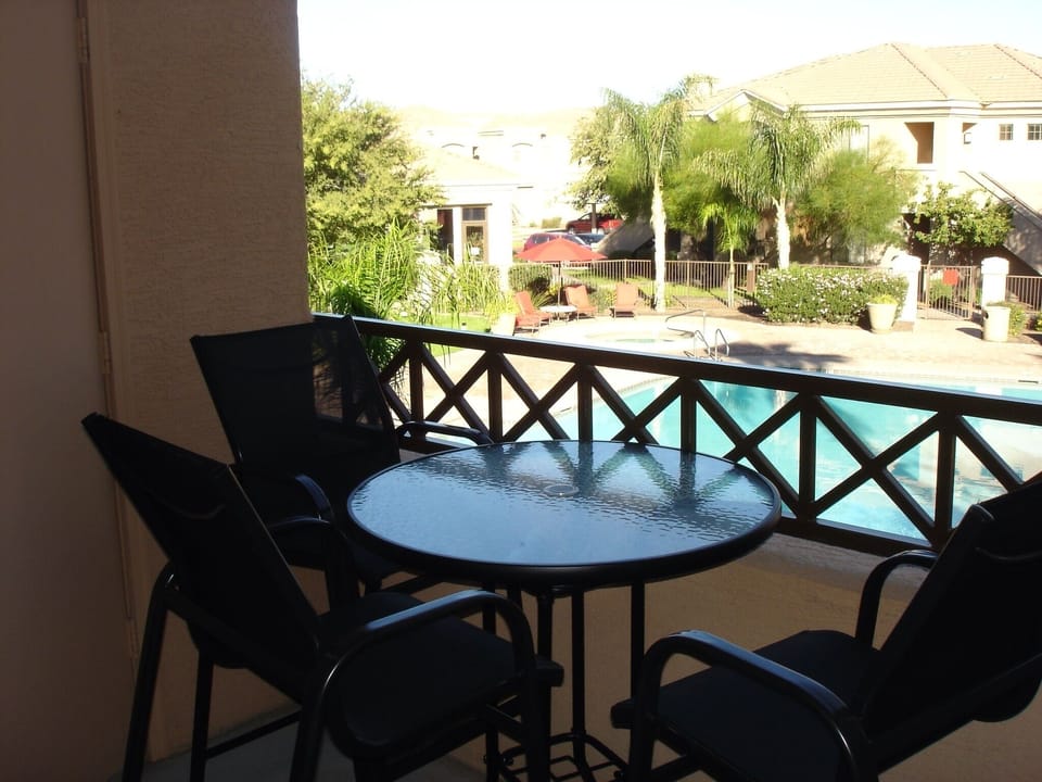 High-top patio table/chairs to take advantage of the beautiful view of the pool
