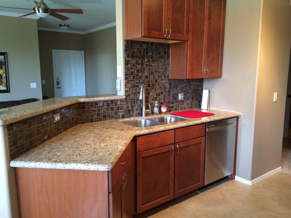 Spacious kitchen with granite counter-tops and lots of cabinet storage space