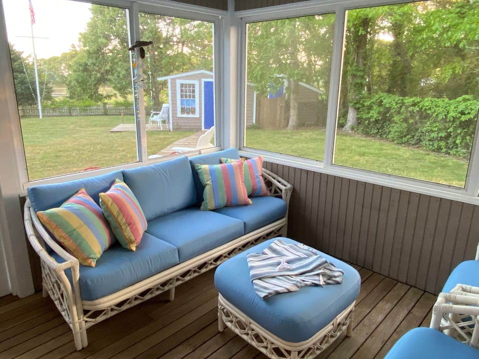 Screeoned porch overlooking Hyannisport Harbor and Nantucket Sound