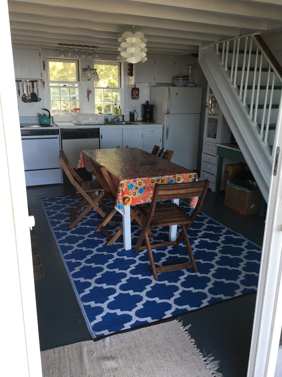Kitchen has one of two working fireplaces.Sunsets light it up rosy & golden.