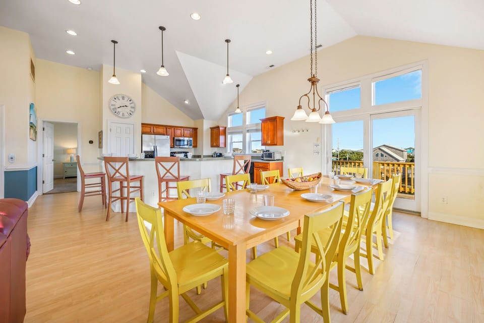 Gather around this bright dining table where meals become memories, with kitchen nearby for easy entertaining.