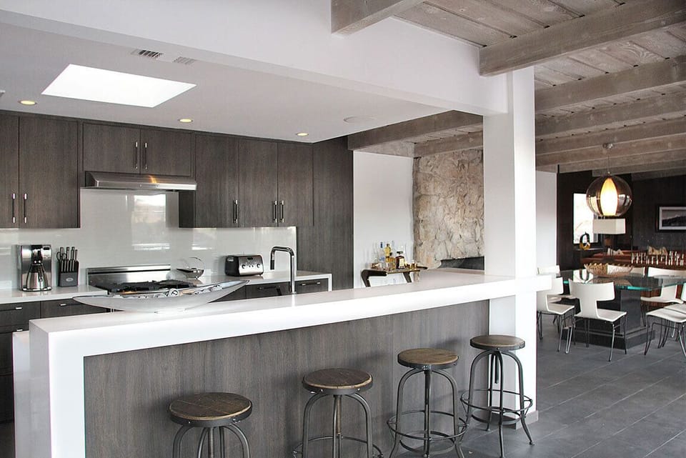 Modern gourmet kitchen featuring Electrolux appliances + Caesarstone countertops