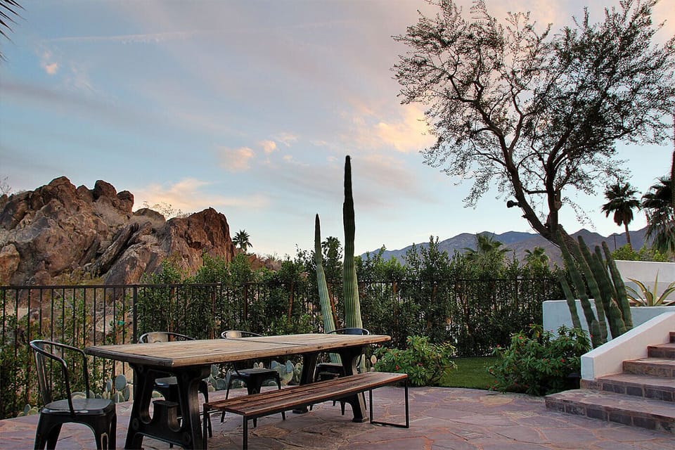 Garden dining with views of the mountains and desert landscape