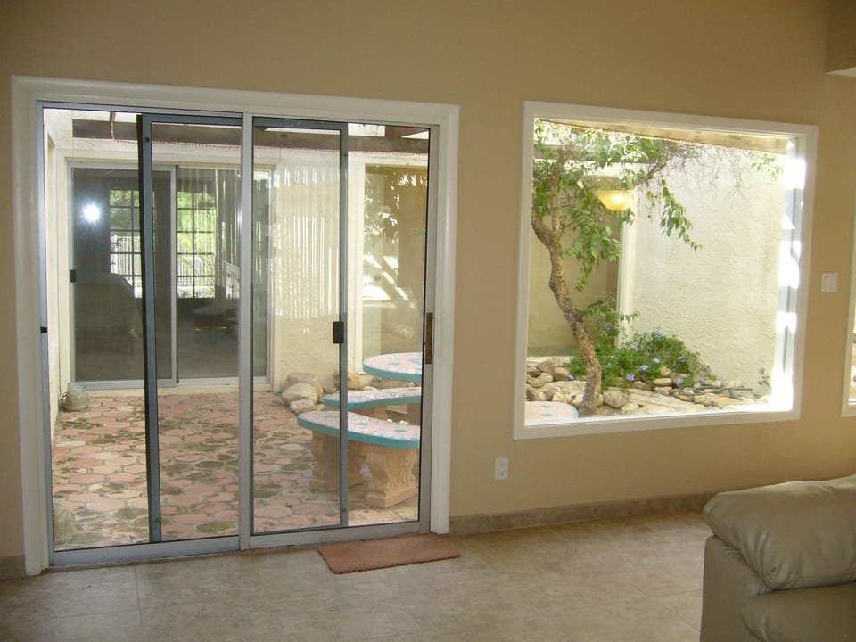 Atrium off of Dining/Sitting area with fountain and foliage
