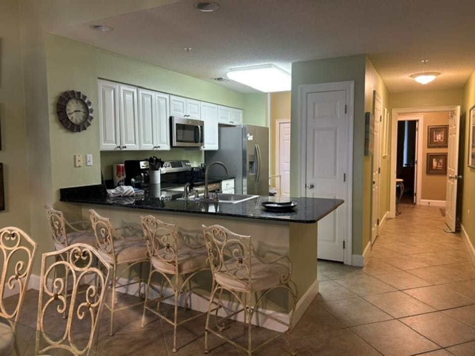 kitchen & on right in backgroud entrance to condo and entrance to 3rd bedroom