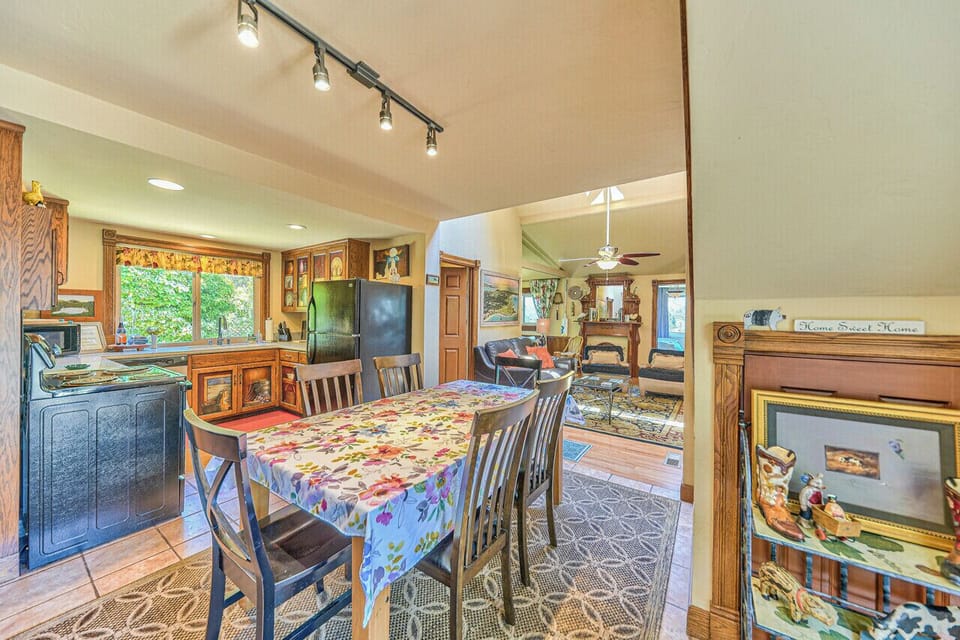 Country kitchen with dining area opening to one family seating area.  
