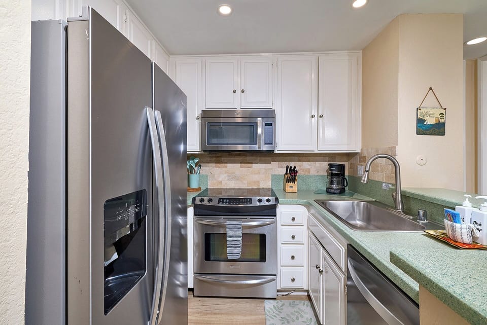 Stocked kitchen, warming drawer on bottom of oven.  New dishwasher & frig. 2024