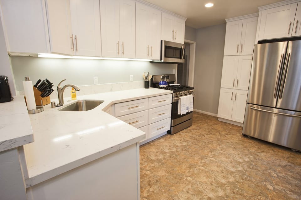 Cooks kitchen with quartz countertops.