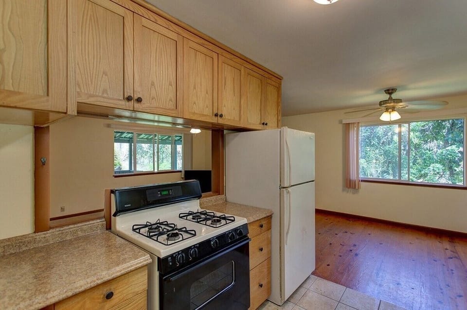 Pass-thru window for cook to stay in contact with others & watch TV.