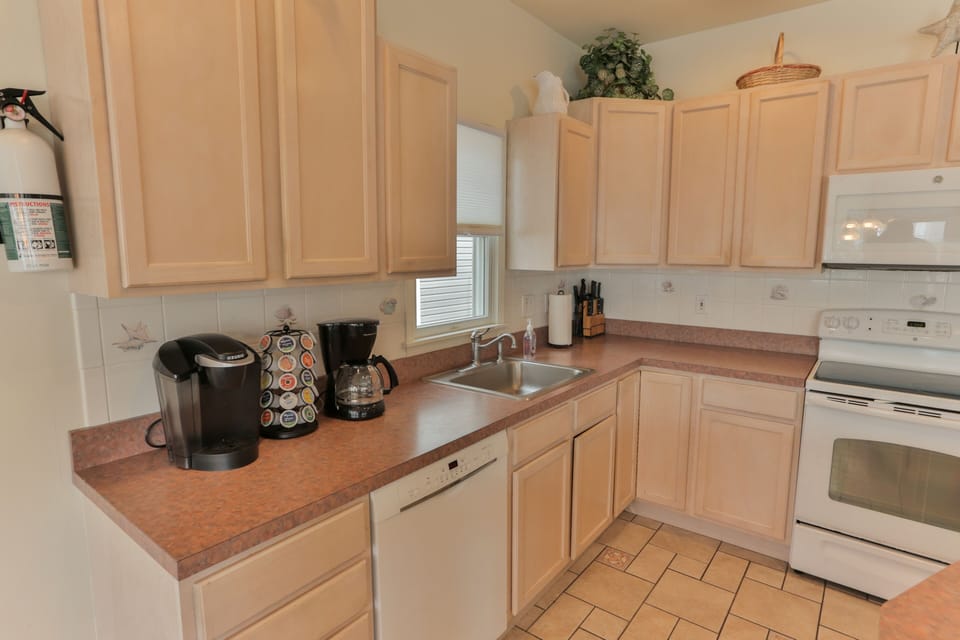 Plenty of counter & cabinet space. Room for lots cooks in the kitchen! 