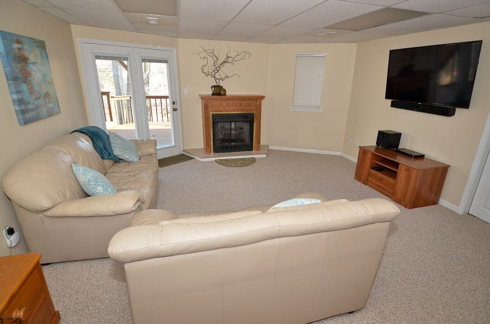 Lower level living area, full sleeper sofa, exit to lower deck, gas fire, TV!