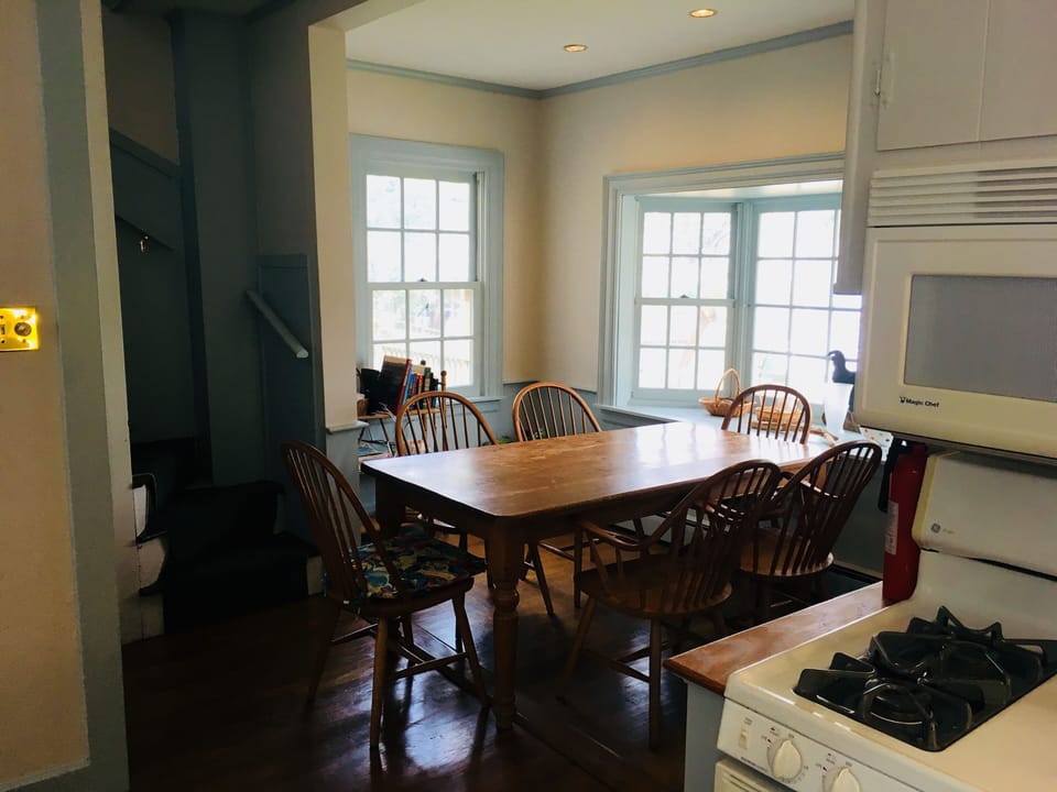 Kitchen eating area seats 6-8 and is next to servant's stairway