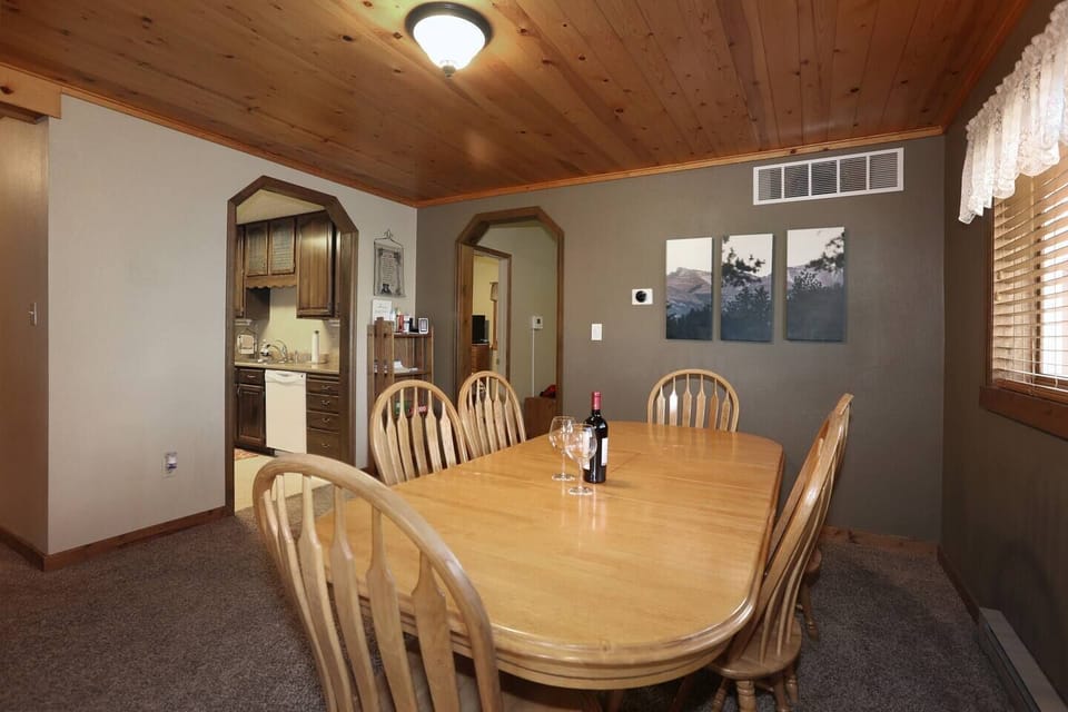 Large dining table just outside Kitchen