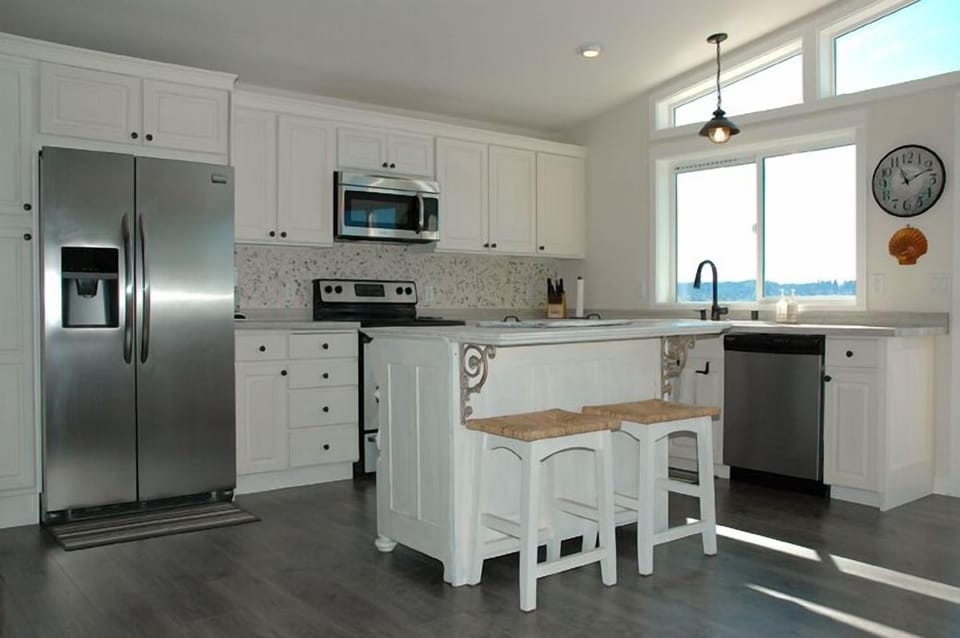 A well equipped kitchen with stainless steel appliances