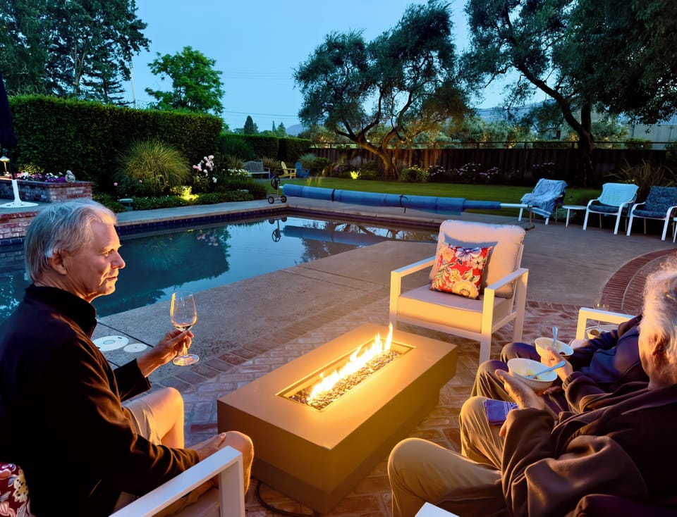 Relax with a glass of wine with a warm and   inviting fire pit table. 