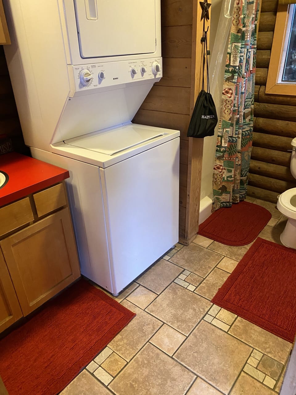 Bathroom with washer and dryer.