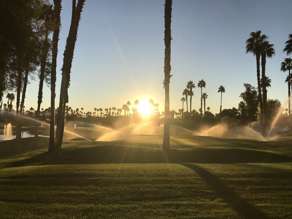 Dawn Breaks with Revitalizing Sprinklers on our Back Patio on the Third Green.