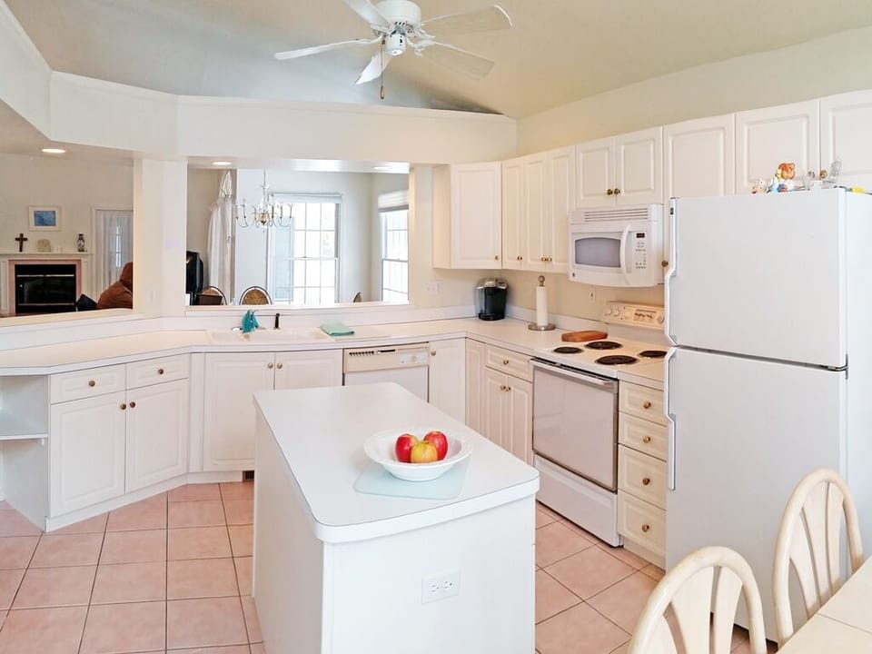 2nd view of the kitchen looking into the dining area and living room. 