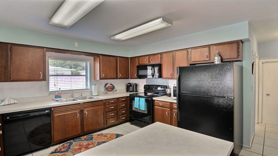 Good size fully equipped kitchen opens into the dining, family and living spaces