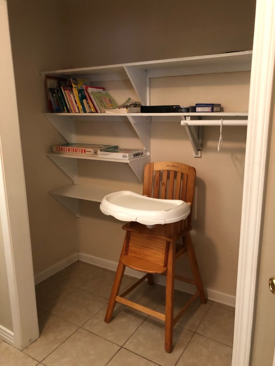 Bedroom 4 closet with high chair and some games available for your use