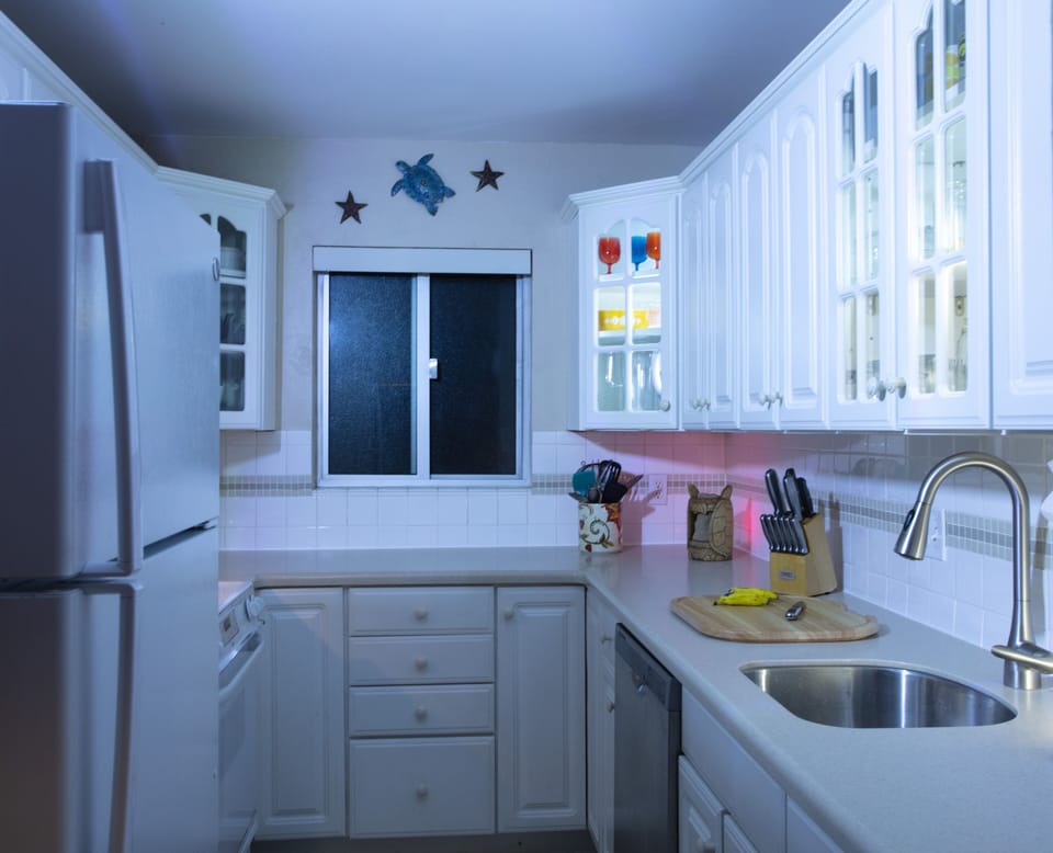 Standard Coffee maker, Grinder and Keurig. Cabinet Lighting for photo shoot only