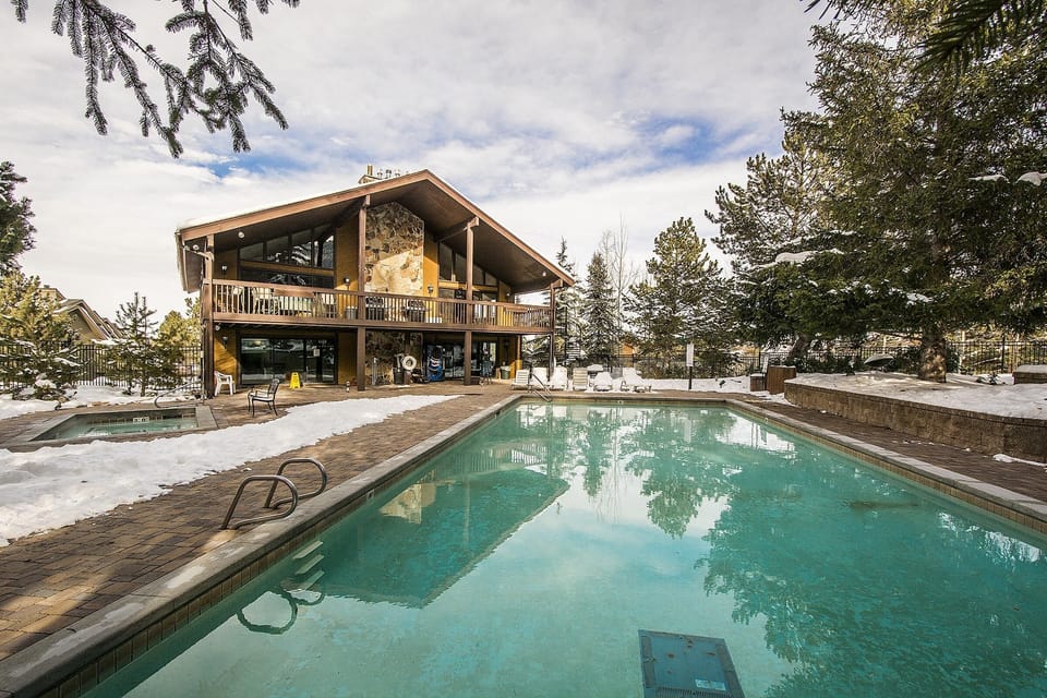 Clubhouse, hot tub, and heated pool