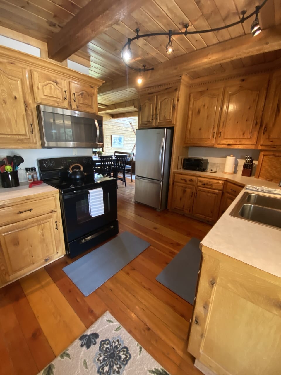 Kitchen looking into main living room and dining room